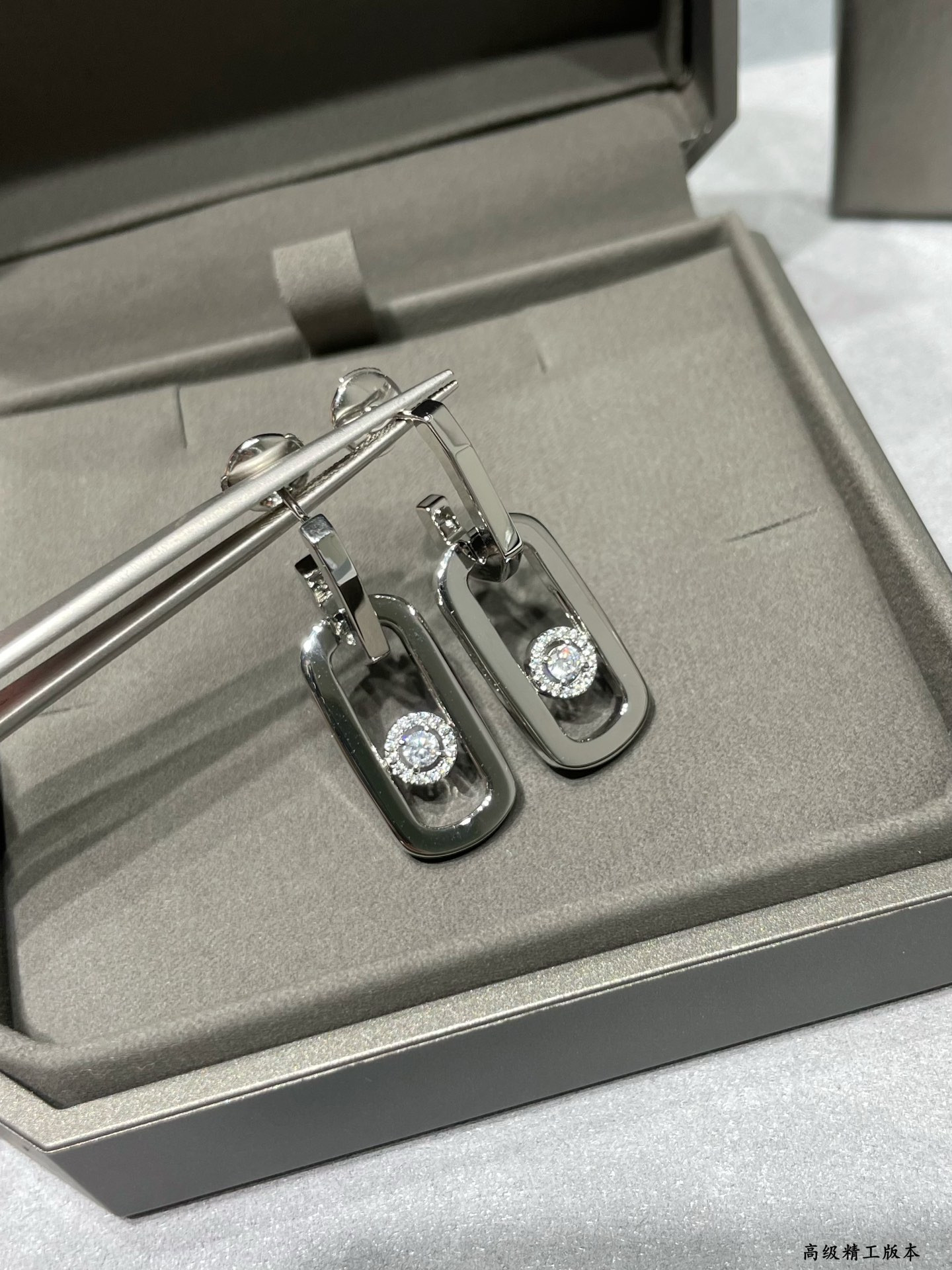 messika large single Di*m*nd moving stud earrings