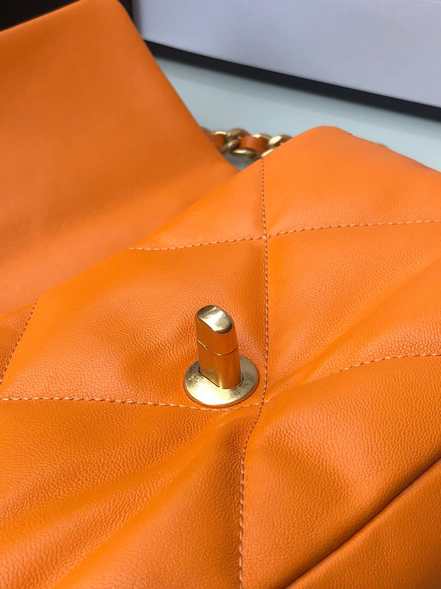 Ch*el 19 handbag shiny leather, gold-tone, silver-tone & ruthenium-finish metal orange 6.2 × 10.1 × 3.5 in