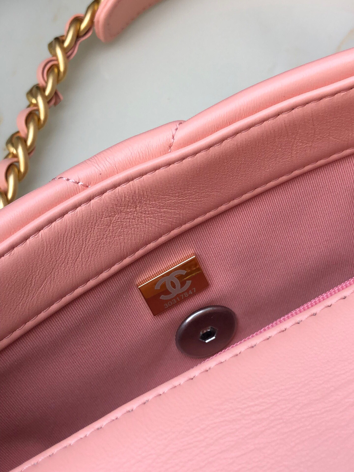 Ch*el 19 handbag shiny leather, gold-tone, silver-tone & ruthenium-finish metal light pink 6.2 × 10.1 × 3.5 in