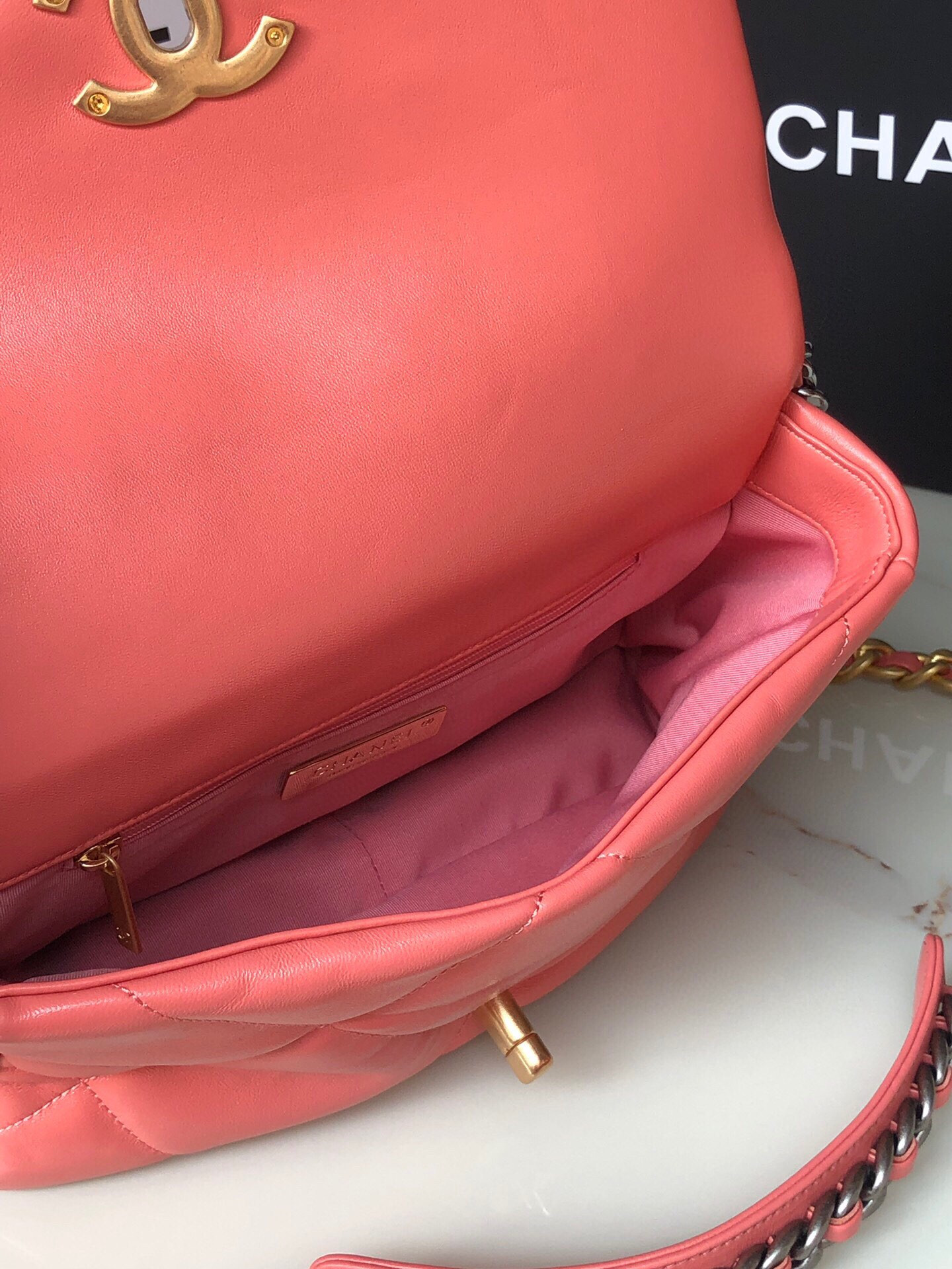 Ch*el 19 handbag shiny pink gold-tone, silver-tone & ruthenium-finish metal 6.2 × 10.1 × 3.5 in