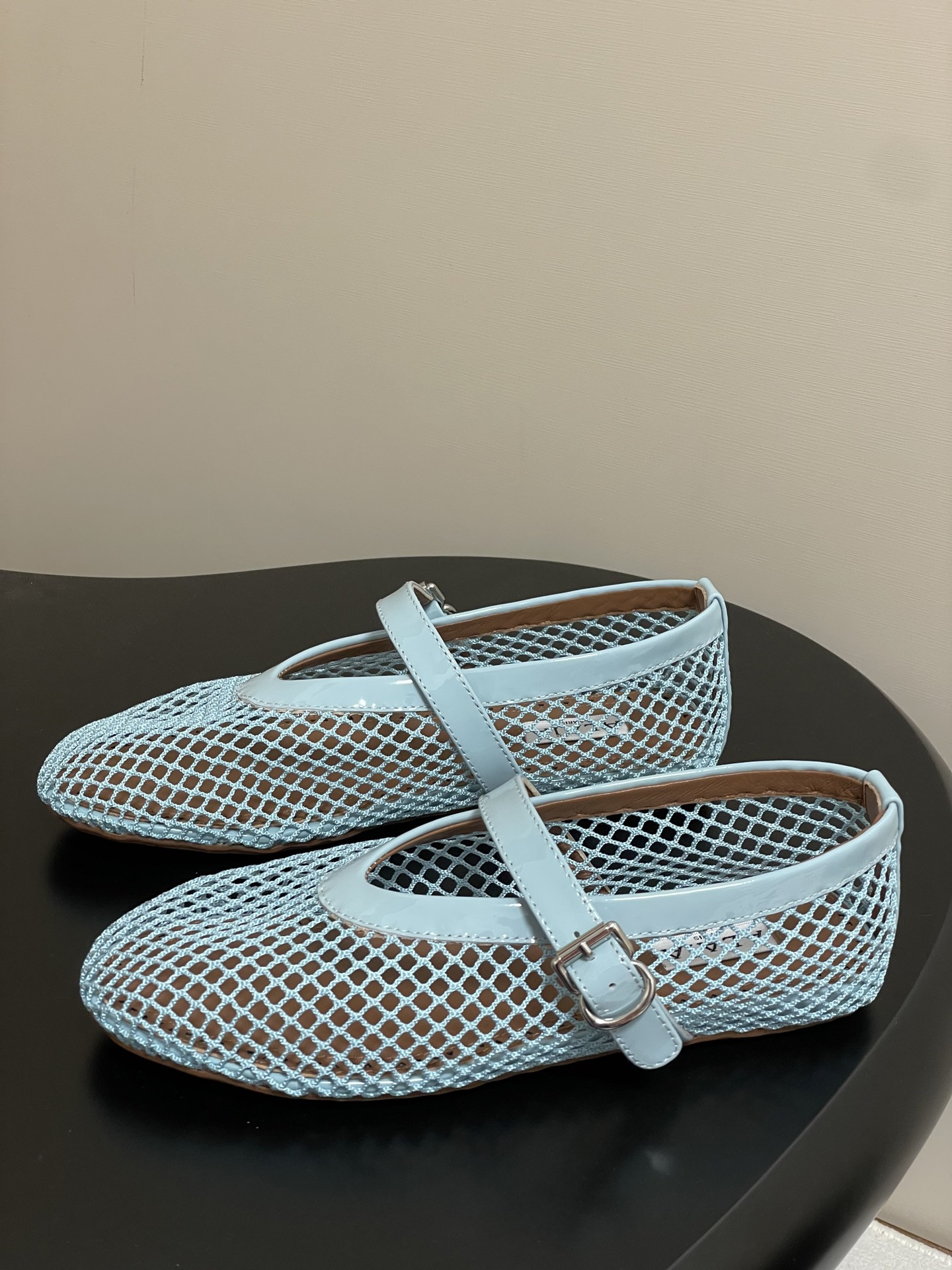 UA ALAÏA BALLET FLATS IN FISHNET